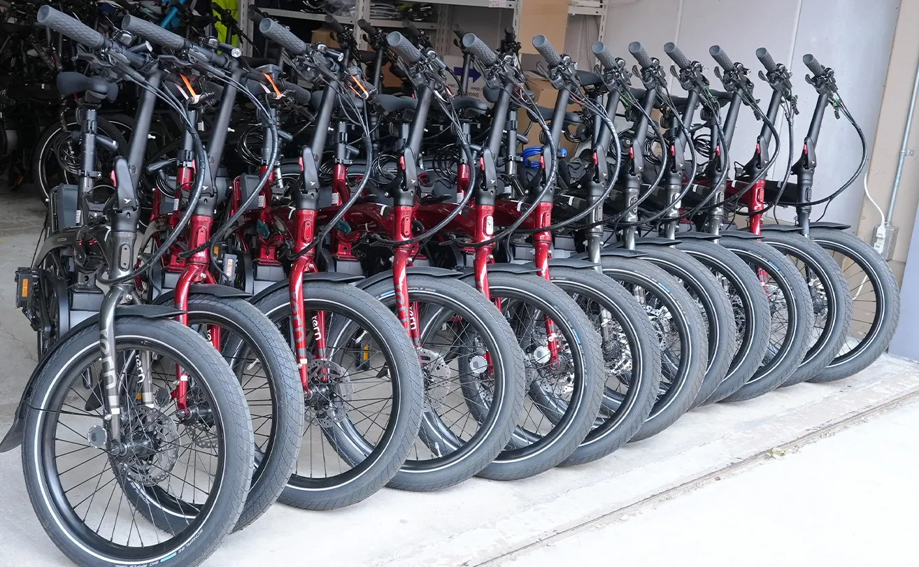Our Tern Vektron e-bikes lined up at the storefront.